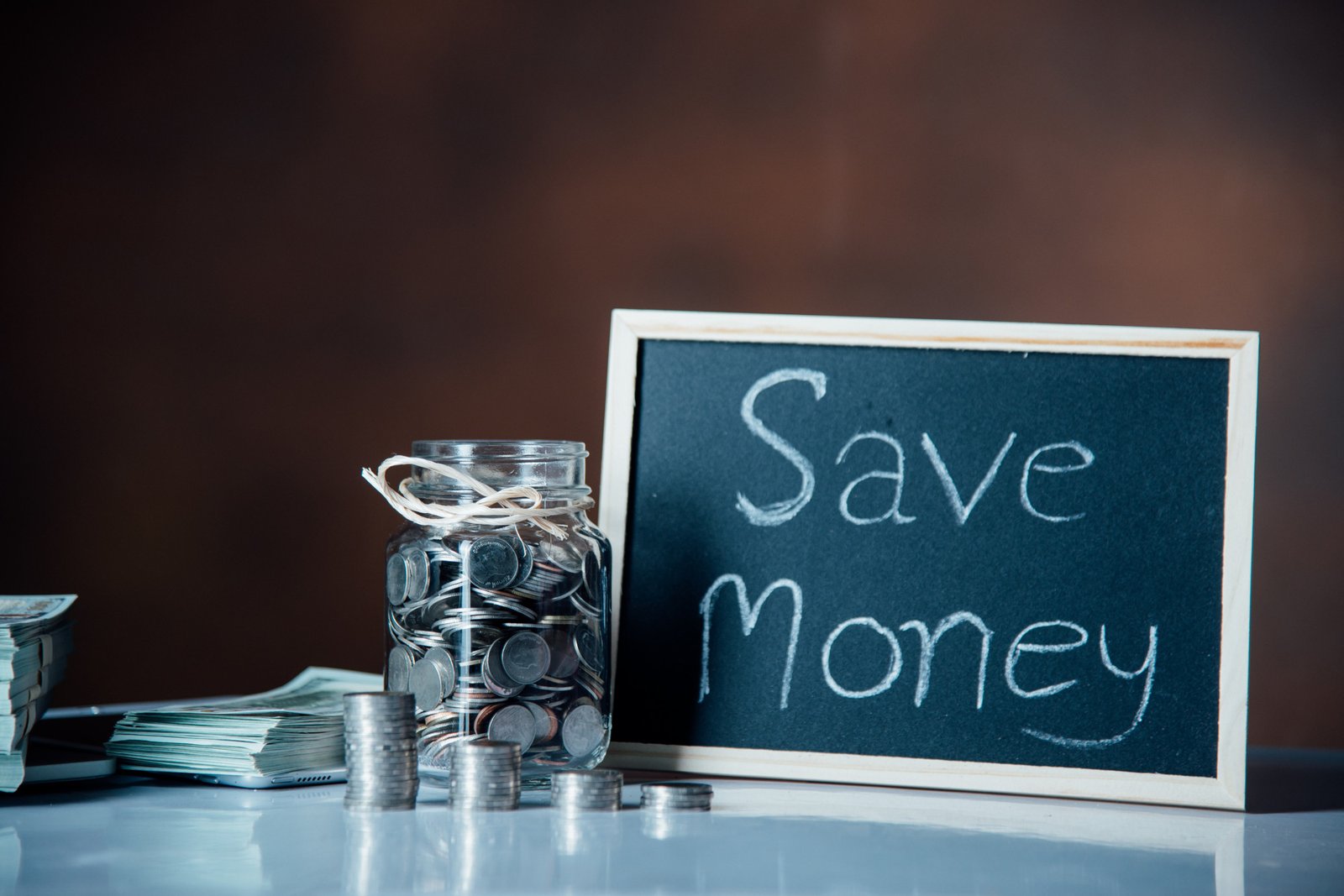 http://img.b2bpic.net/free-photo/bottles-cash-with-coins-saving-money-concept_1150-12563.jpg
