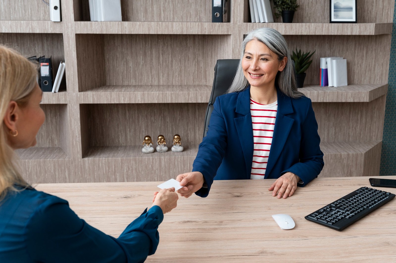 http://img.b2bpic.net/free-photo/smiley-women-holding-blank-business-card_23-2149343387.jpg